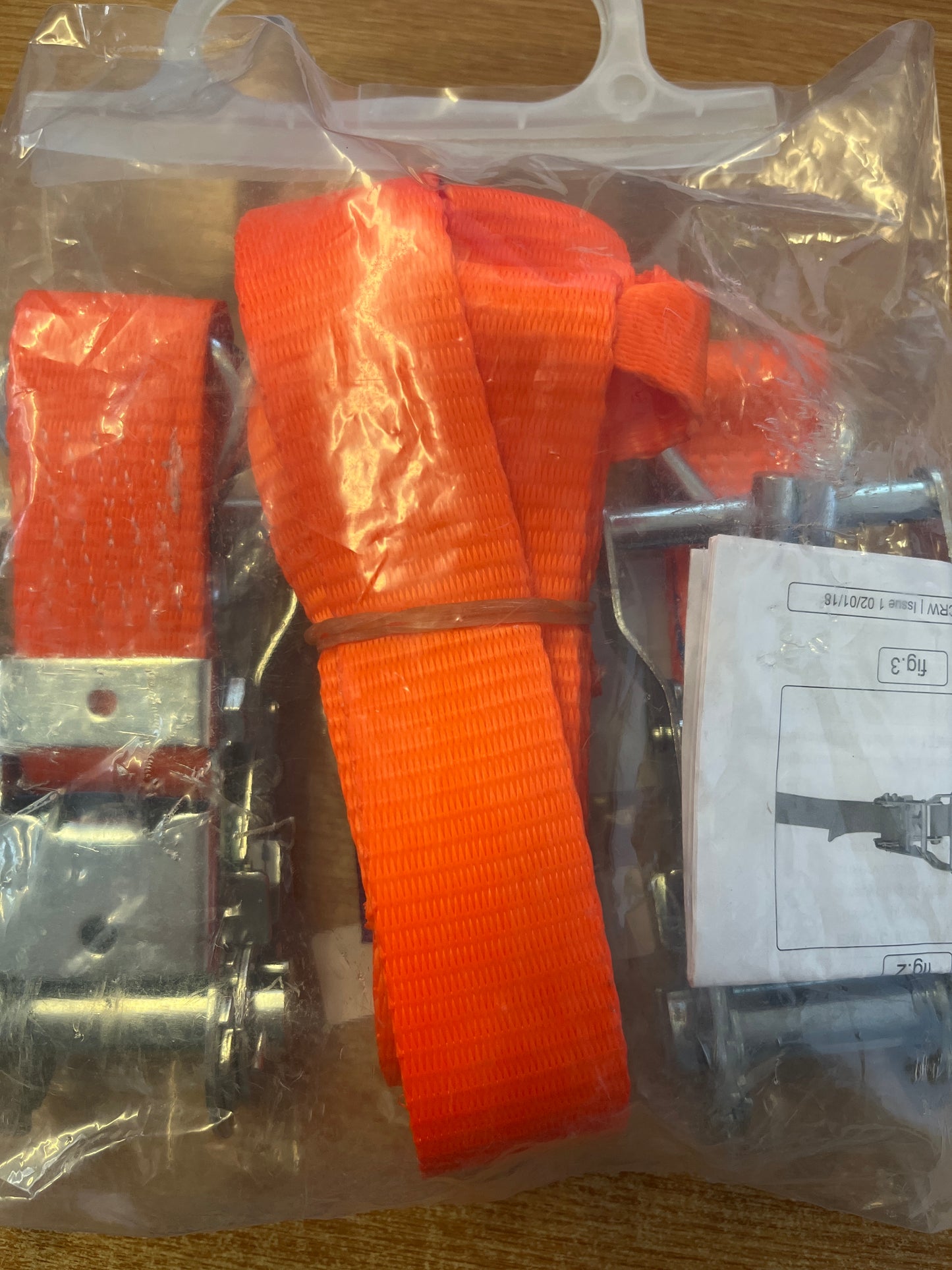 Motorcycle rear wheel tie down