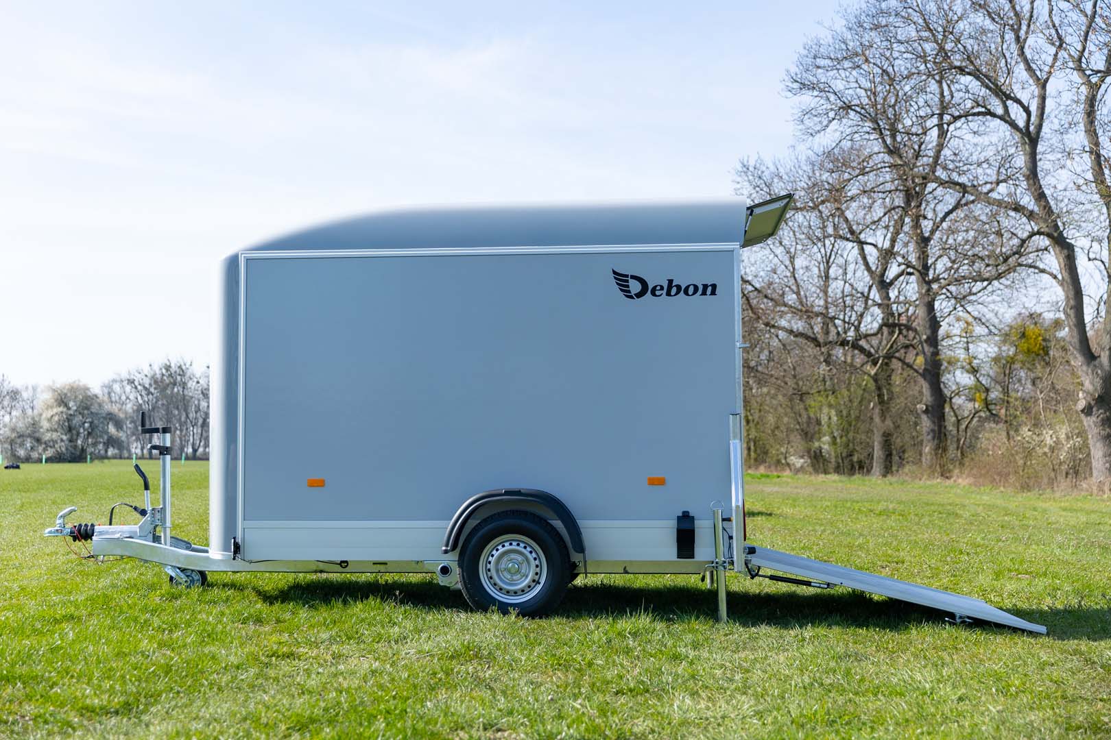 Debon C300 Box Van Trailer Side View in White with Composite Sides and Ramp Down.