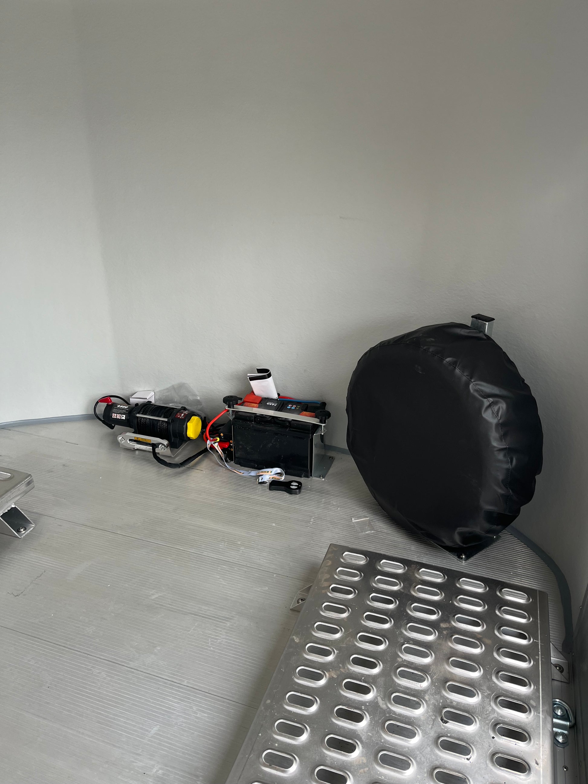 Close-Up of Debon C1000 Electric Winch and Mounted Spare Wheel