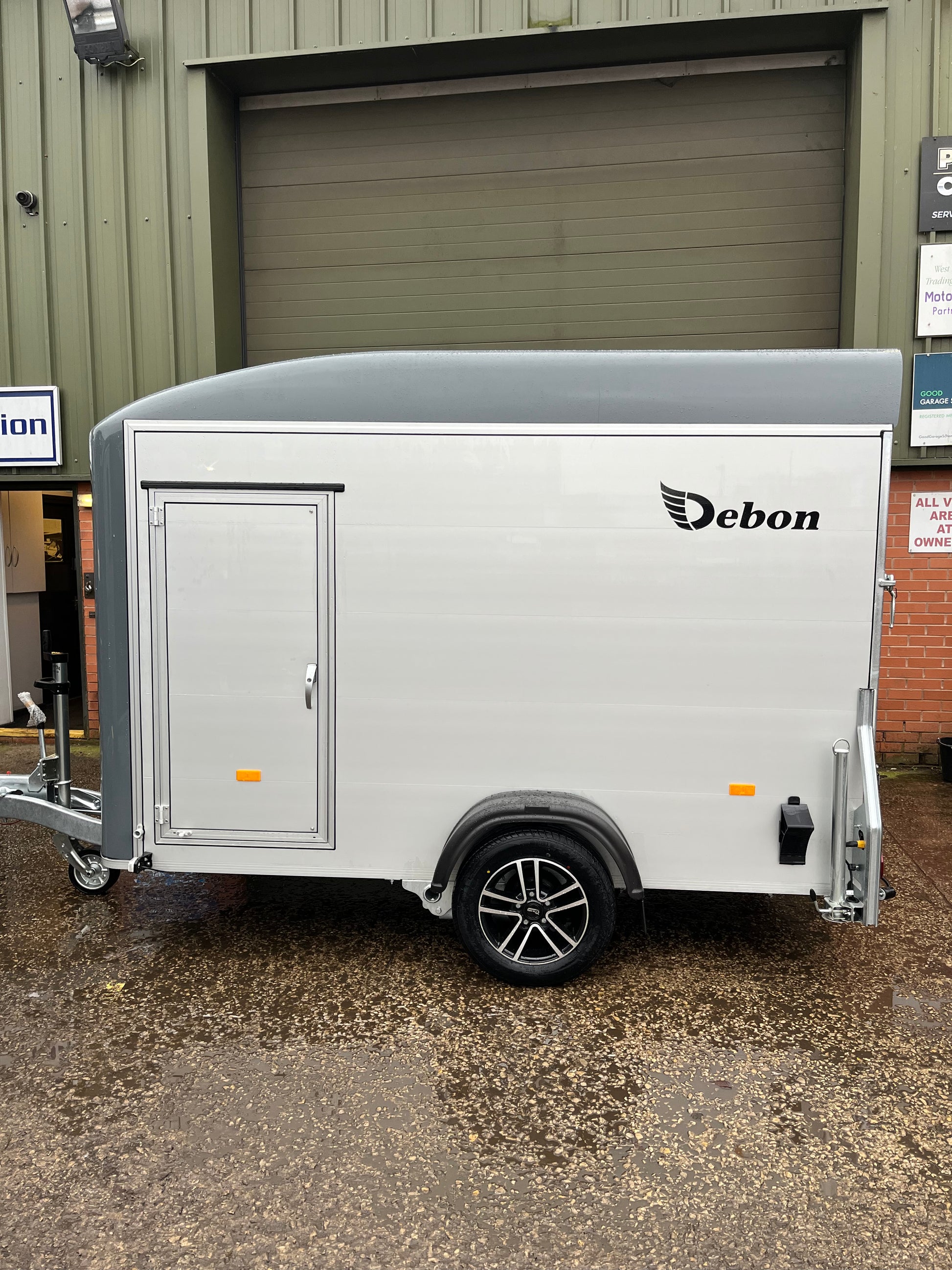 Debon C300 box trailer side view in grey