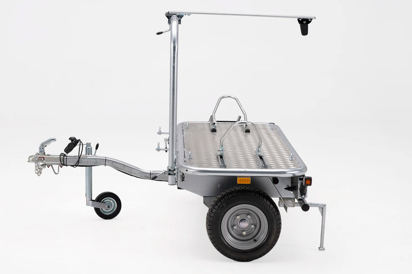 Motorbike secured on Debon MOTO COMPACT trailer with chocks and steady bar