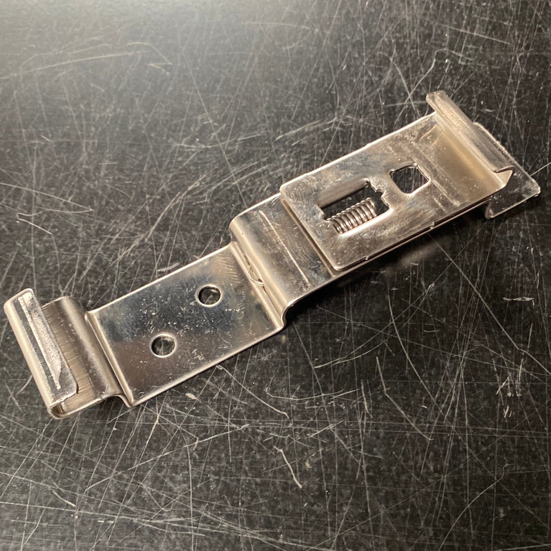 Number plate holder spring loaded