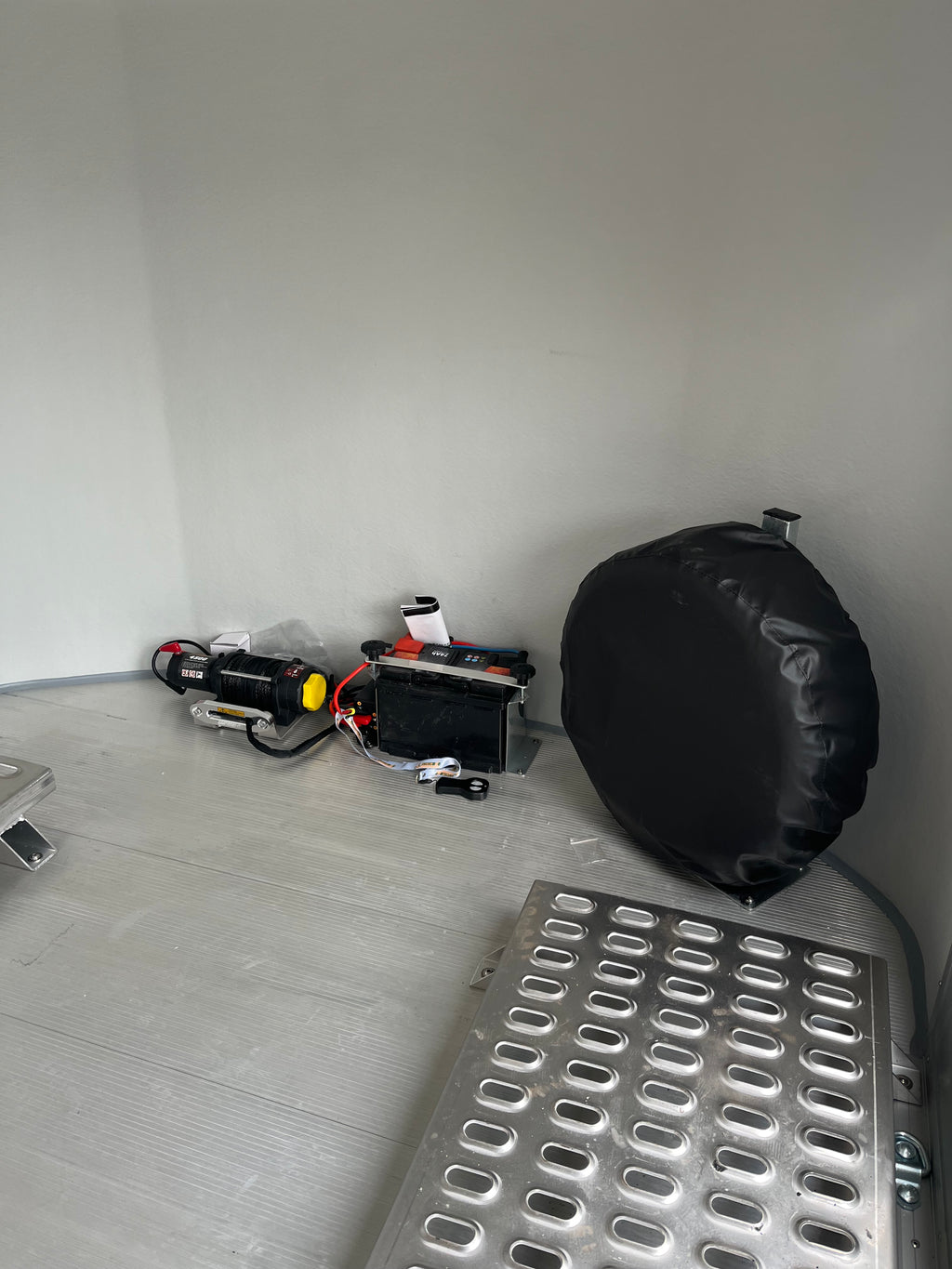 Close-Up of Debon C1000 Electric Winch and Mounted Spare Wheel