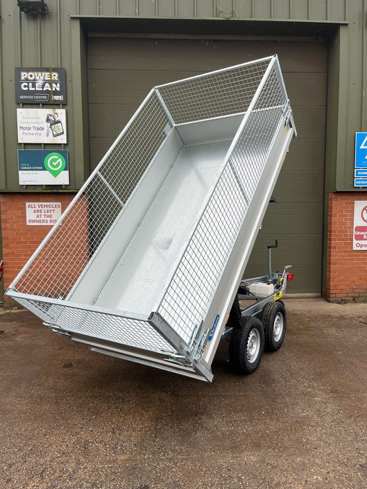 Debon PW1.2 electric tipping trailer with mesh sides, tipped up.